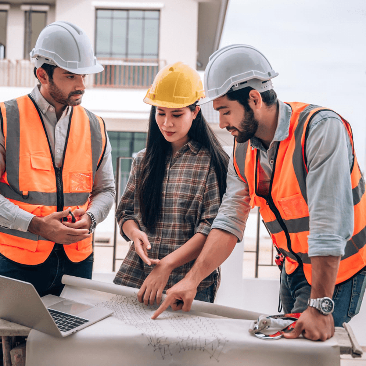 Construction professionals reviewing plans